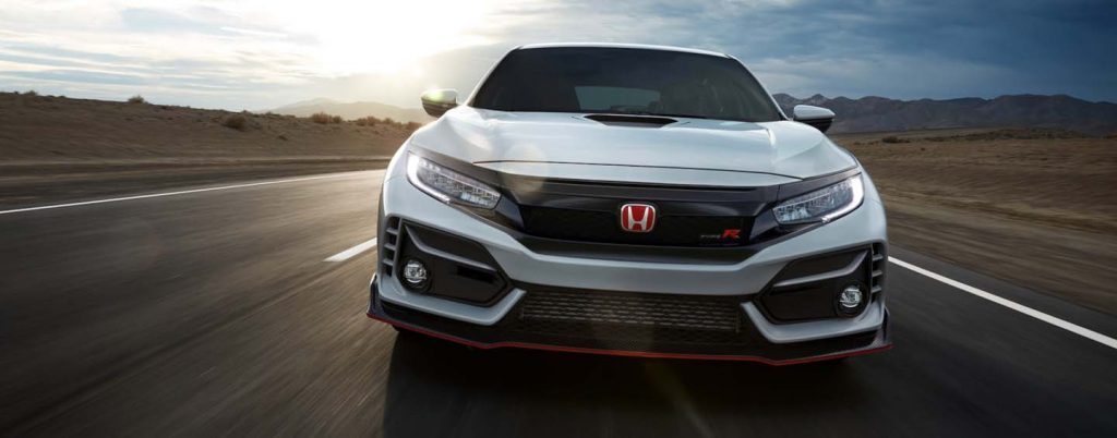 Front end view of Honda Civic Type R driving on track